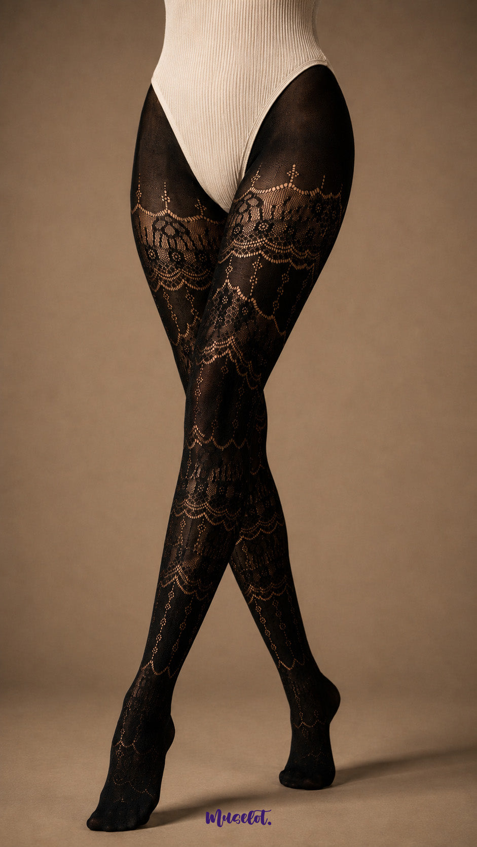 A focused view of crossed legs wearing full-length black lace stockings with intricate ornate motifs, semi-sheer sections and covered toes - Muselot