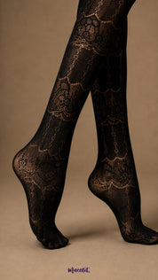 Close-up of black designer lace stockings showing intricate ornamental lace pattern, semi-sheer texture and fully covered feet - Muselot