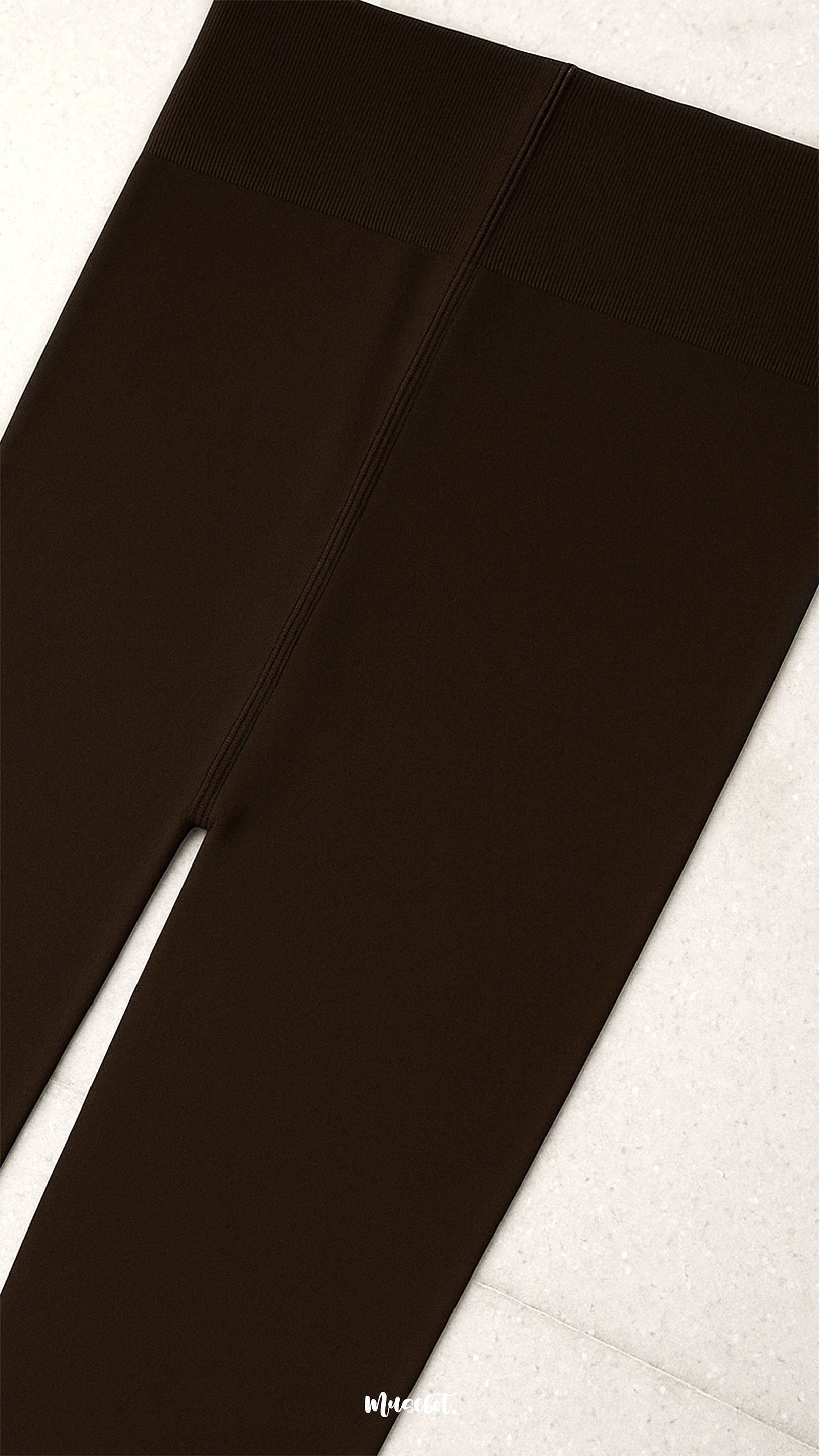 A detailed close-up of semi-opaque brown tights with a secure ribbed waistband and reinforced stitching, highlighting comfort fit, durability, and support - Muselot"
