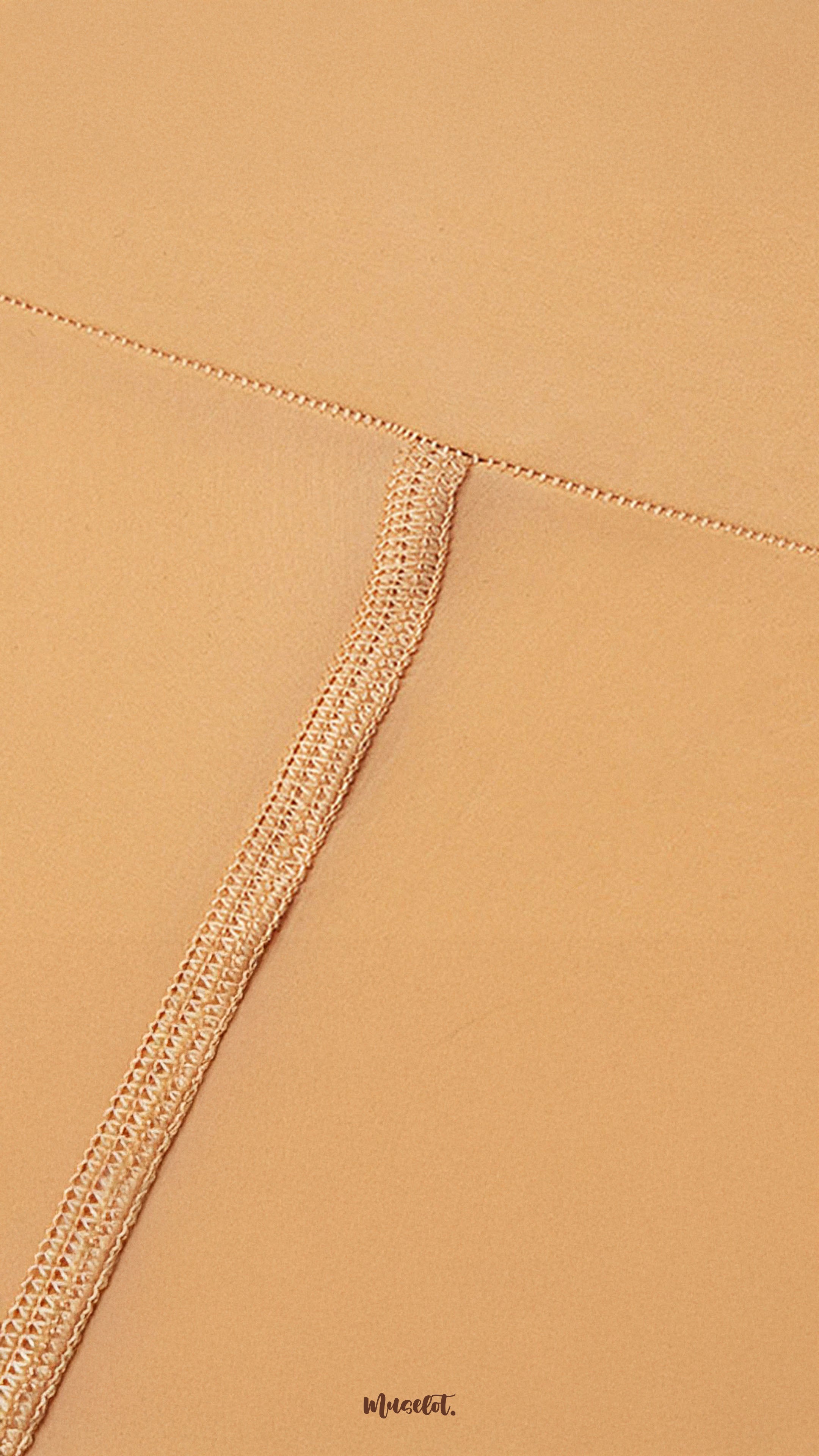 Close-up of secure waistband stitching on skin colored tights, highlighting strong seams, durability, and premium silken finish - Muselot
