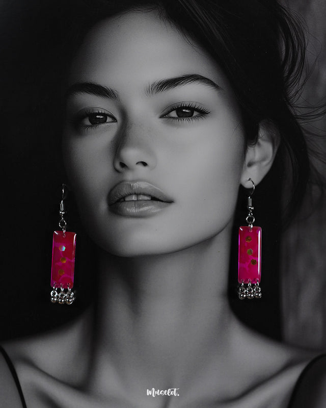 A model wearing the warm glow-up drop earrings, showcasing their radiant shine and enhancing any outfit with effortless elegance – Muselot