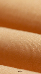 Zoomed-in shot of breathable skin-colored tights material, highlighting the smooth silken weave, lightweight texture, and premium finish - Muselot