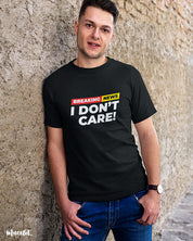 Breaking news I don't care printed t shirts for men and women in black colour