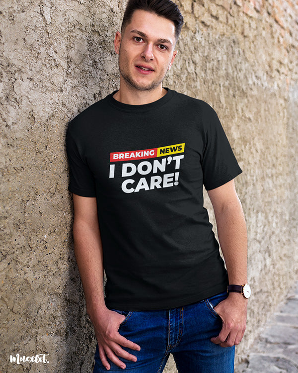 Breaking news I don't care printed t shirts for men and women in black colour