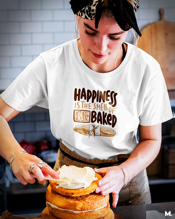 White t shirt printed with Happiness is smell of freshly baked bread for baking lovers.