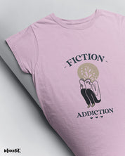 Fiction addiction design illustrated printed t shirt in light pink colour at Muselot for book lovers 