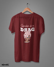 Gender is a drag design illustrated graphic t shirt in maroon colour at Muselot for LGBTQ+ pride community 