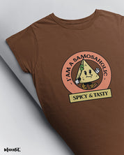 I am a samosaholic cute design illustrated graphic t shirt in coffee brown colour at Muselot 